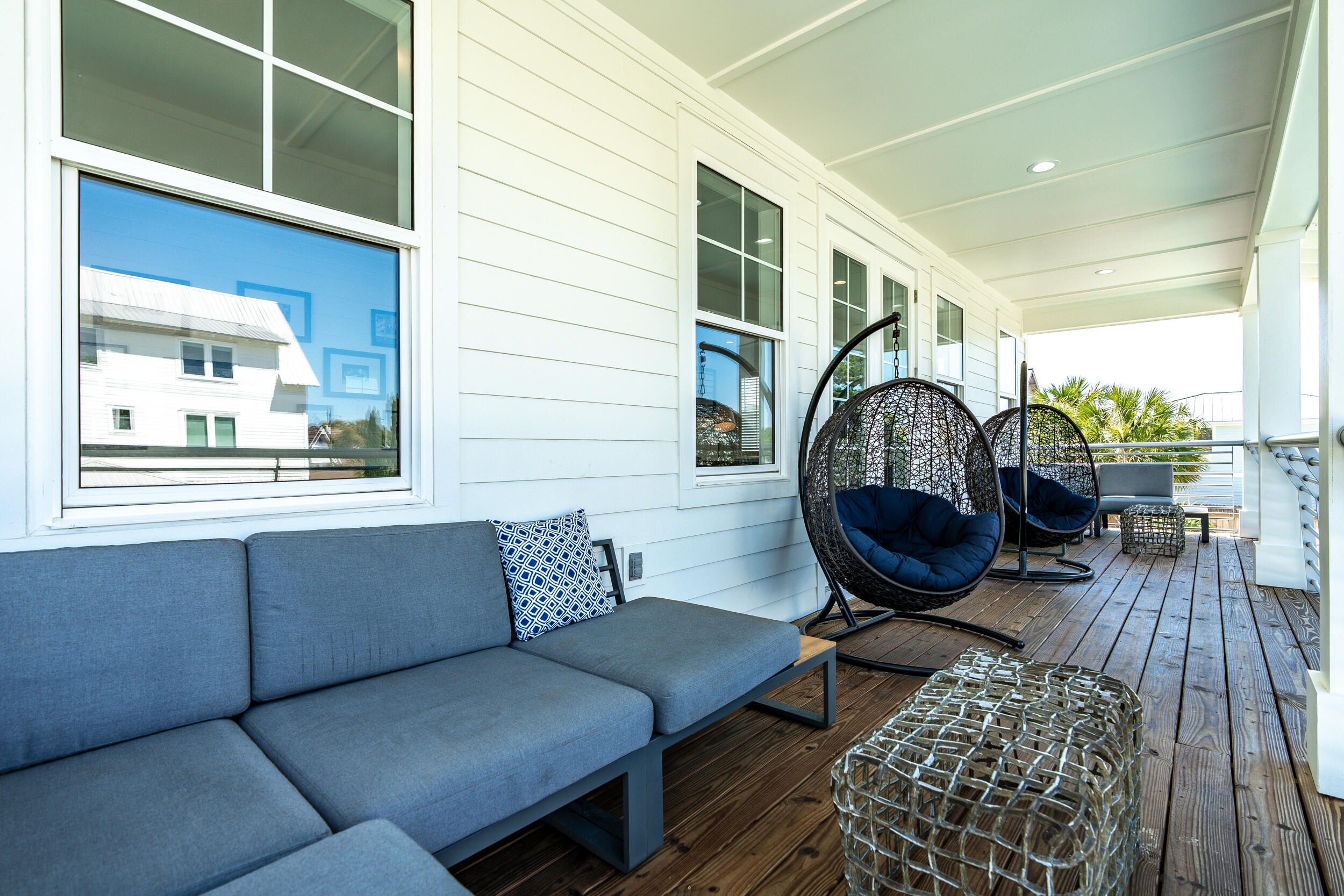 88 Pompano Street Destin, FL 32541 - Photo 73 of 109 a living room with furniture a rug and a window