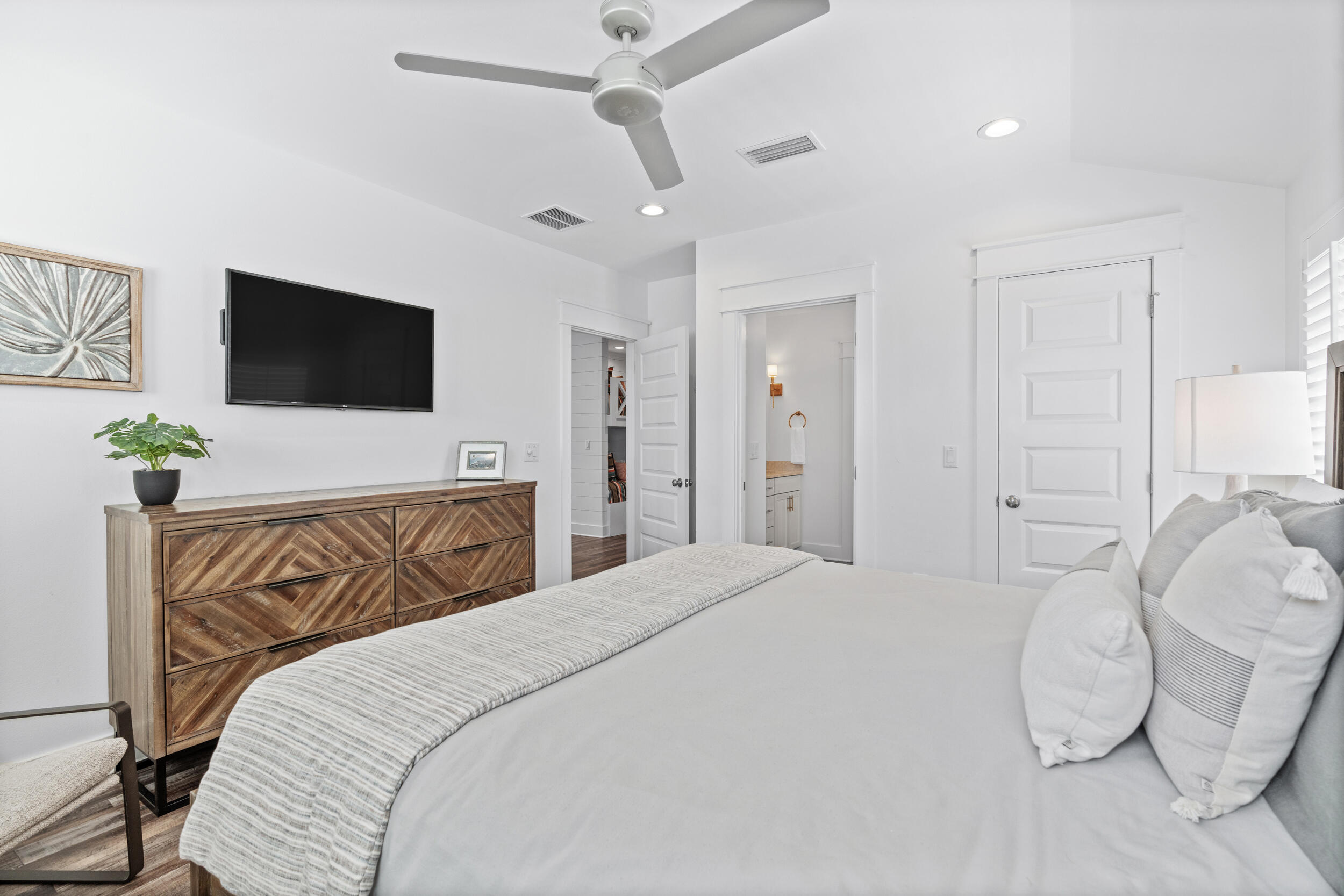 88 Pompano Street Destin, FL 32541 - Photo 79 of 109 a bedroom with a bed and a flat screen tv
