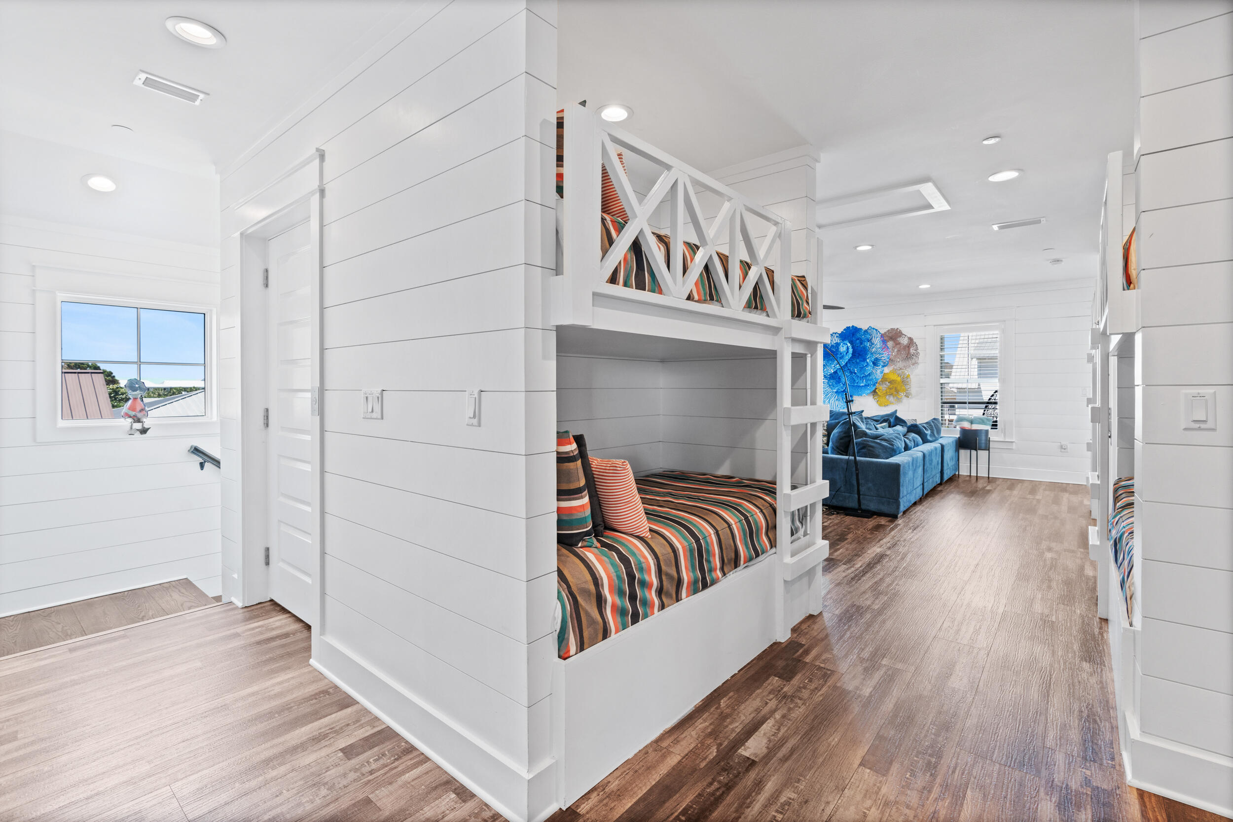 88 Pompano Street Destin, FL 32541 - Photo 86 of 109 a living room with furniture and a wooden floor