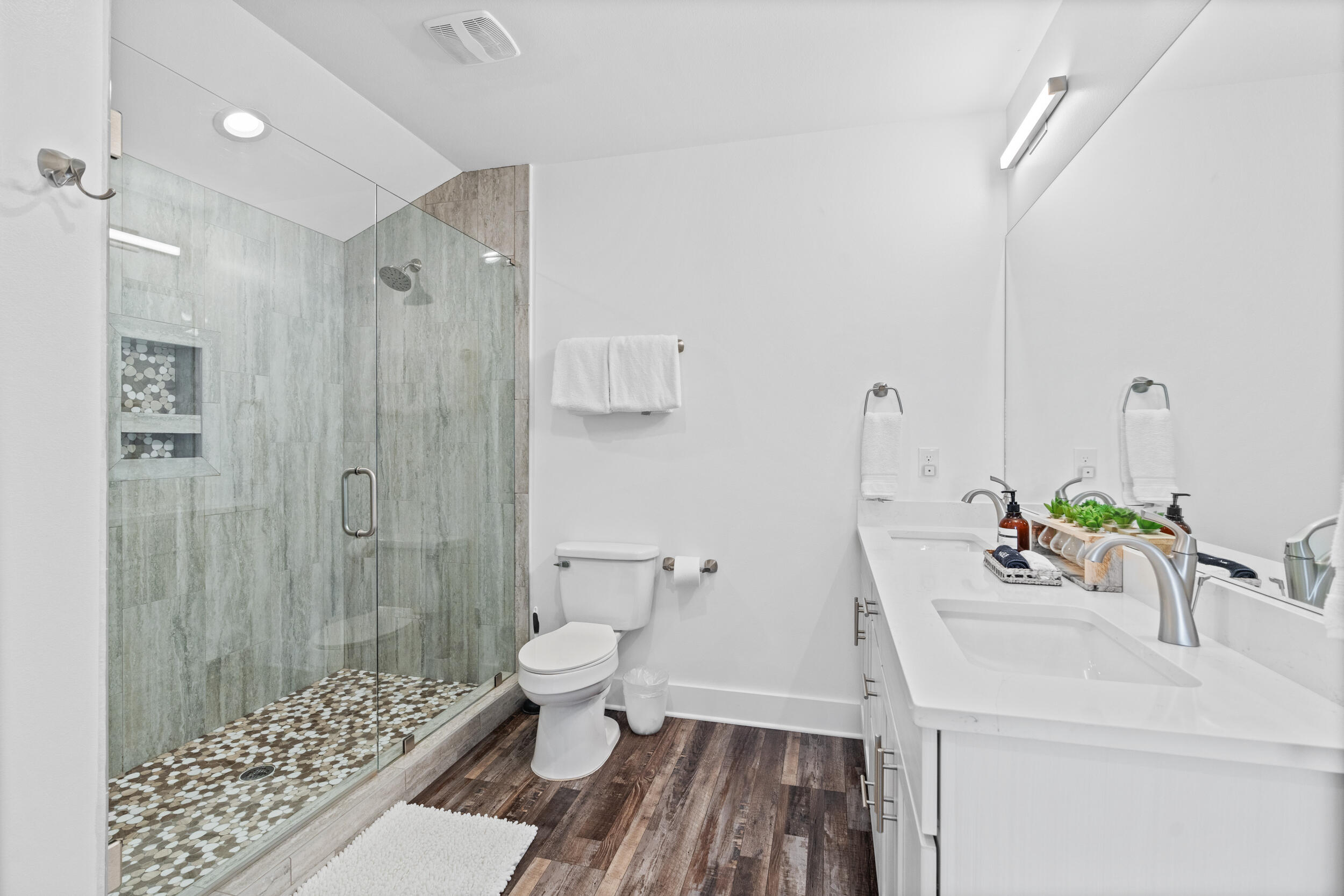 88 Pompano Street Destin, FL 32541 - Photo 96 of 109 a bathroom with a sink toilet a shower and a mirror