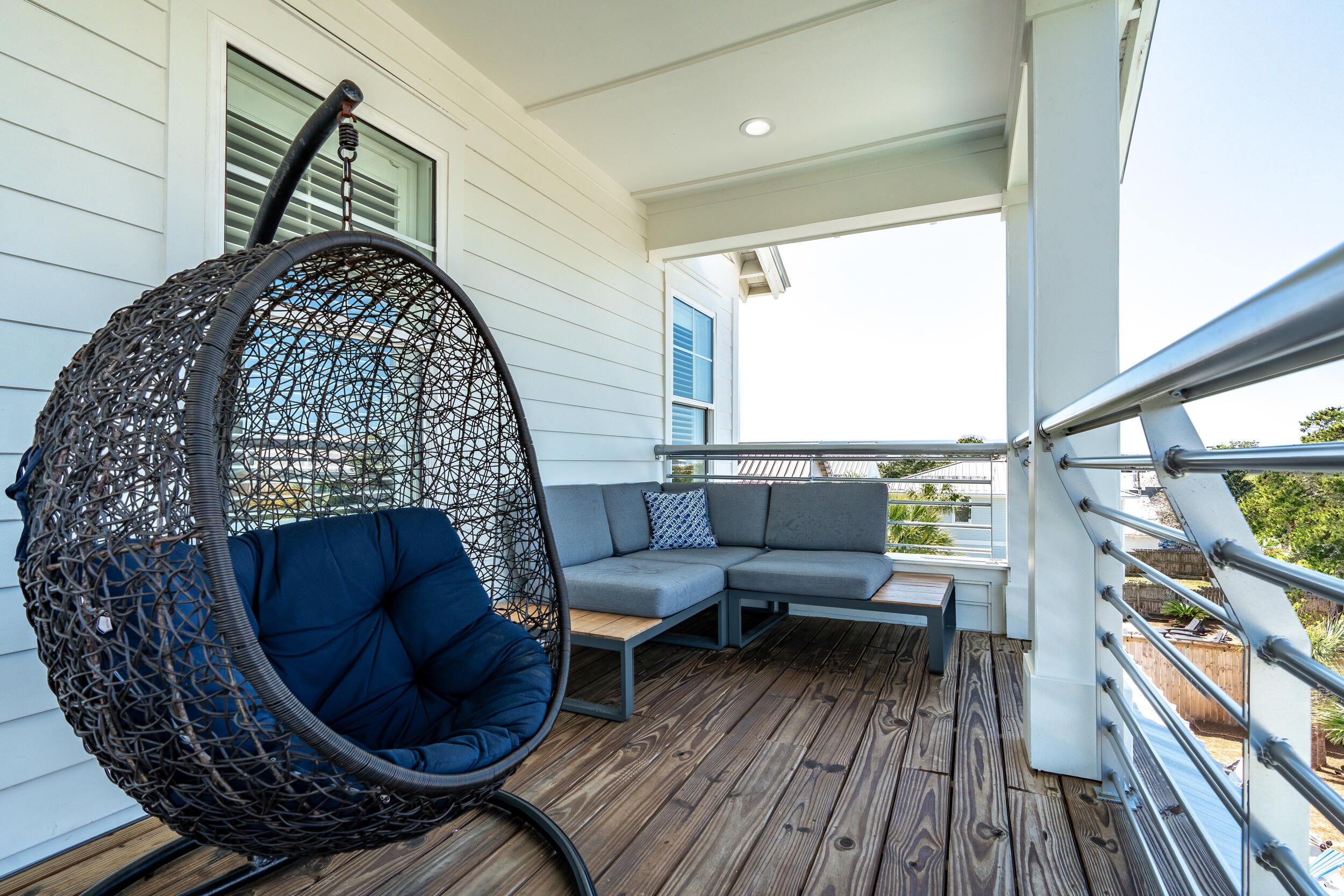 88 Pompano Street Destin, FL 32541 - Photo 98 of 109 a living room with furniture and a wooden floor