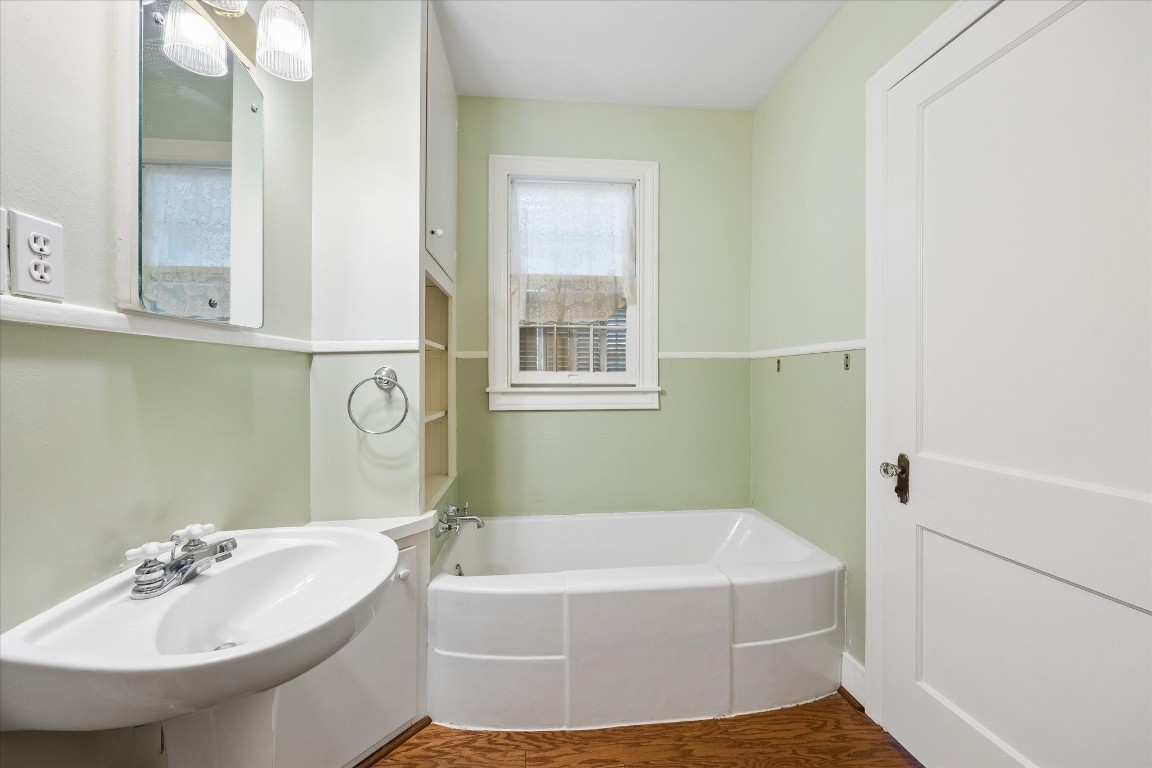 5130 Wonder Hill Road Chappell Hill, TX 77426 - Photo 14 of 31 a bathroom with a sink and a bathtub