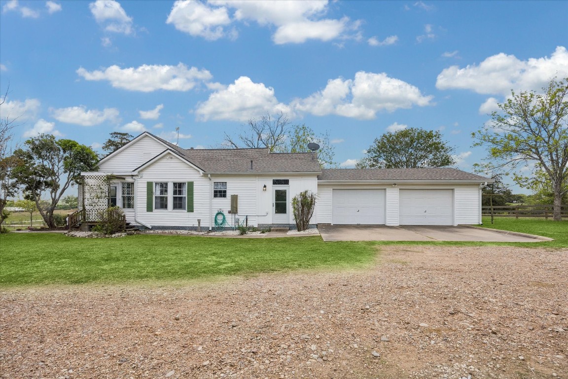 5130 Wonder Hill Road Chappell Hill, TX 77426 - Photo 5 of 31 a view of a house with a yard and a large tree