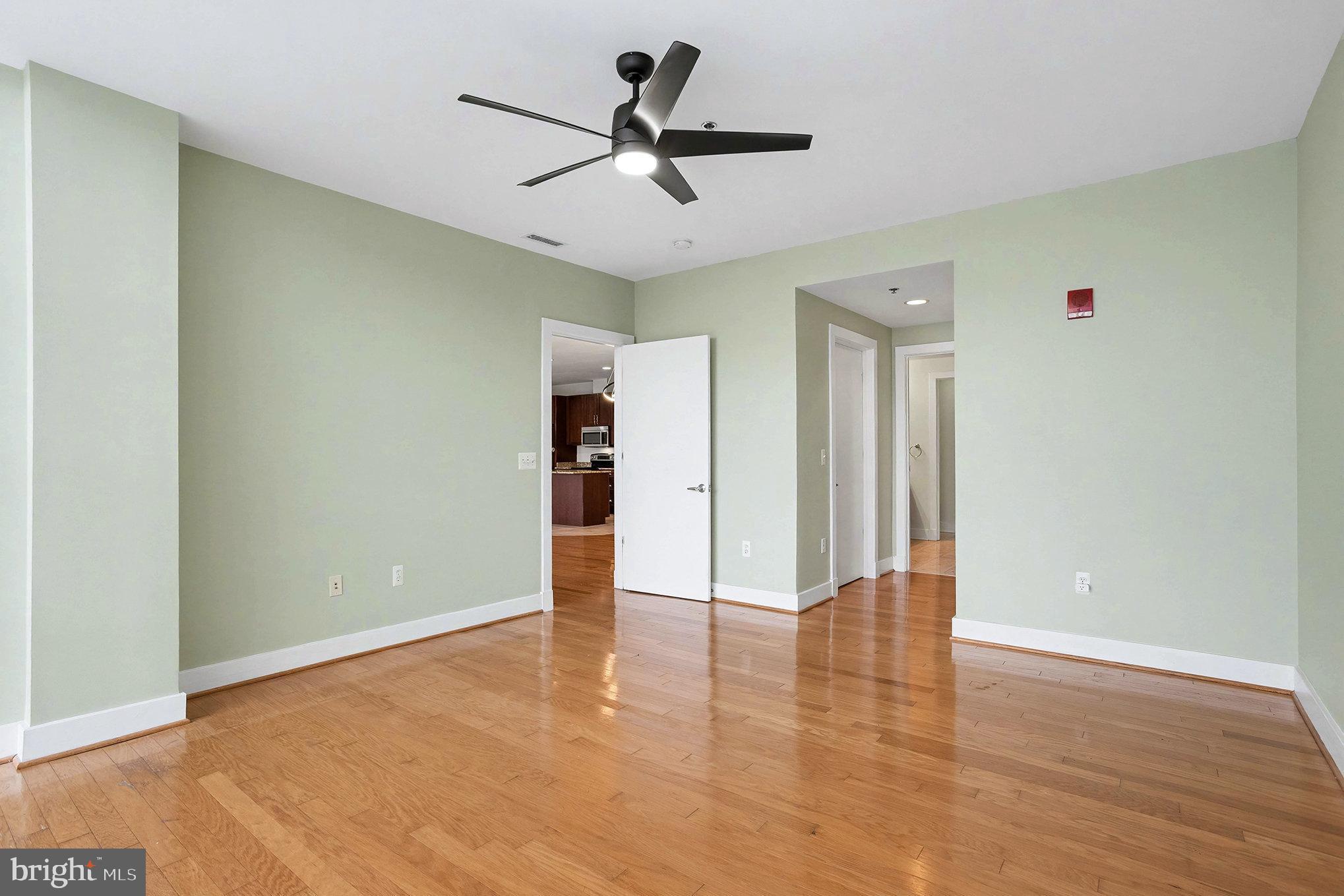 2772 Lighthouse Point East, Unit 201 Baltimore, MD 21224 - Photo 18 of 36 wooden floor in an empty room