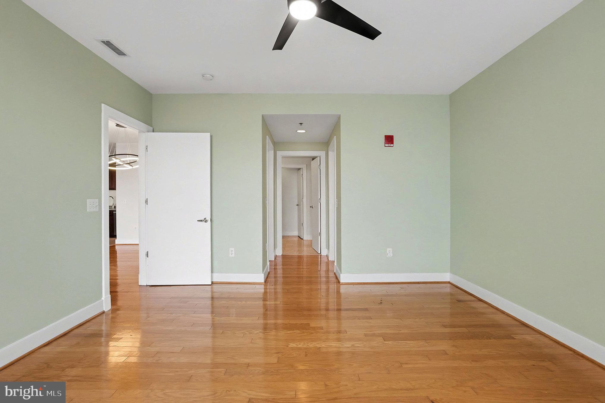 2772 Lighthouse Point East, Unit 201 Baltimore, MD 21224 - Photo 19 of 36 a view of empty room with wooden floor