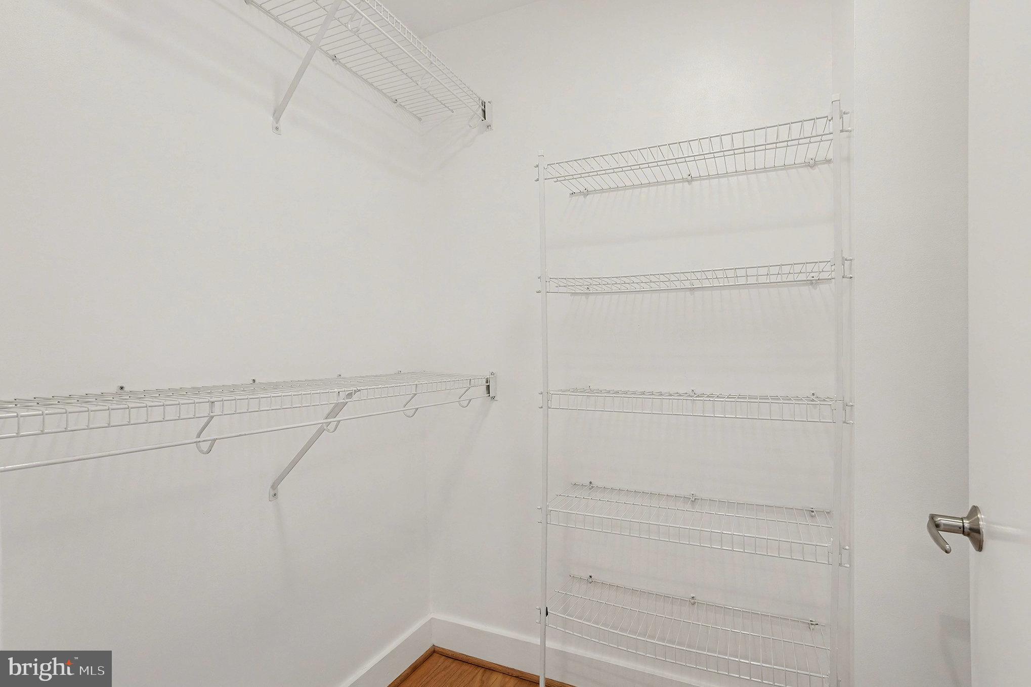 2772 Lighthouse Point East, Unit 201 Baltimore, MD 21224 - Photo 22 of 36 a view of a room with racks on the wall