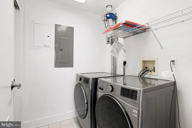 a view of storage and utility room with washer and dryer