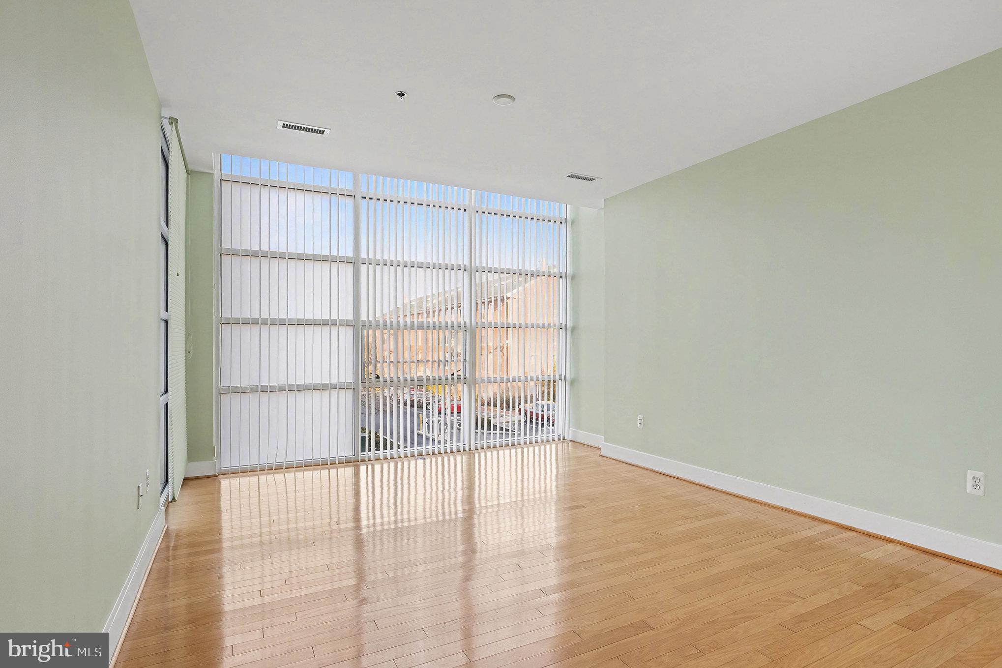 2772 Lighthouse Point East, Unit 201 Baltimore, MD 21224 - Photo 29 of 36 a view of an empty room with a window