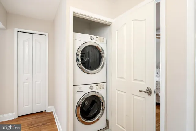 a view of a hallway with washer and dryer