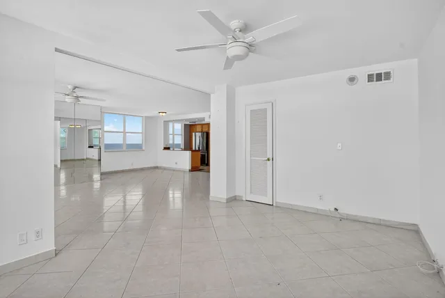 a view of an empty room with a window