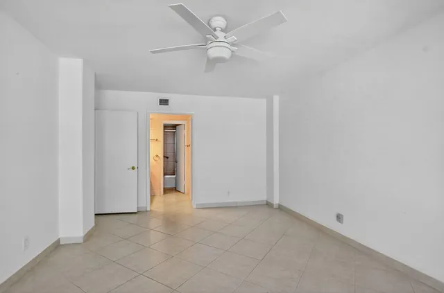 a bathroom with a shower sink and toilet