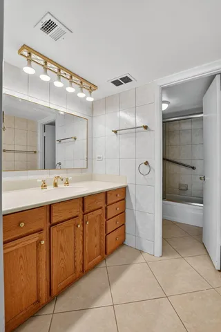 a bathroom with a toilet and shower