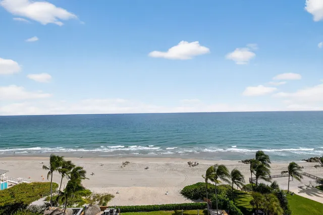 an aerial view of beach and ocean