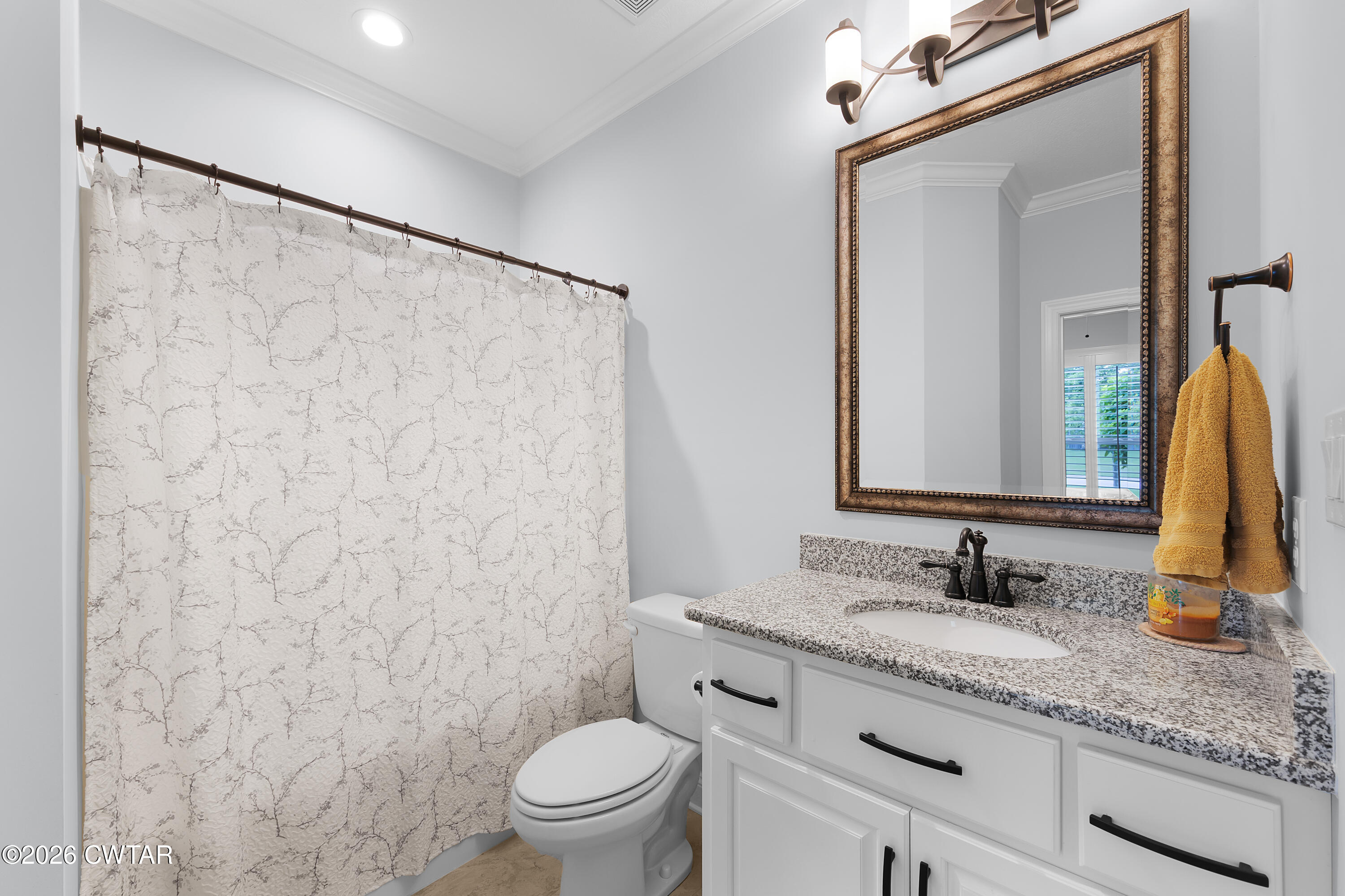 34 Cheddleton Cove Jackson, TN 38305 - Photo 18 of 32 a bathroom with a granite countertop sink toilet and shower