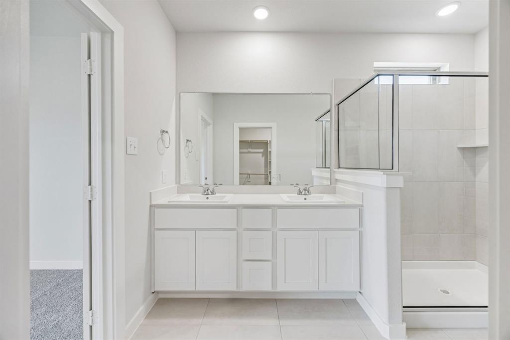 1132 Del Rio Drive Lavon, TX 75166 - Photo 24 of 39 Primary Bathroom in the Stanley II home plan by Trophy Signature Homes – REPRESENTATIVE PHOTO