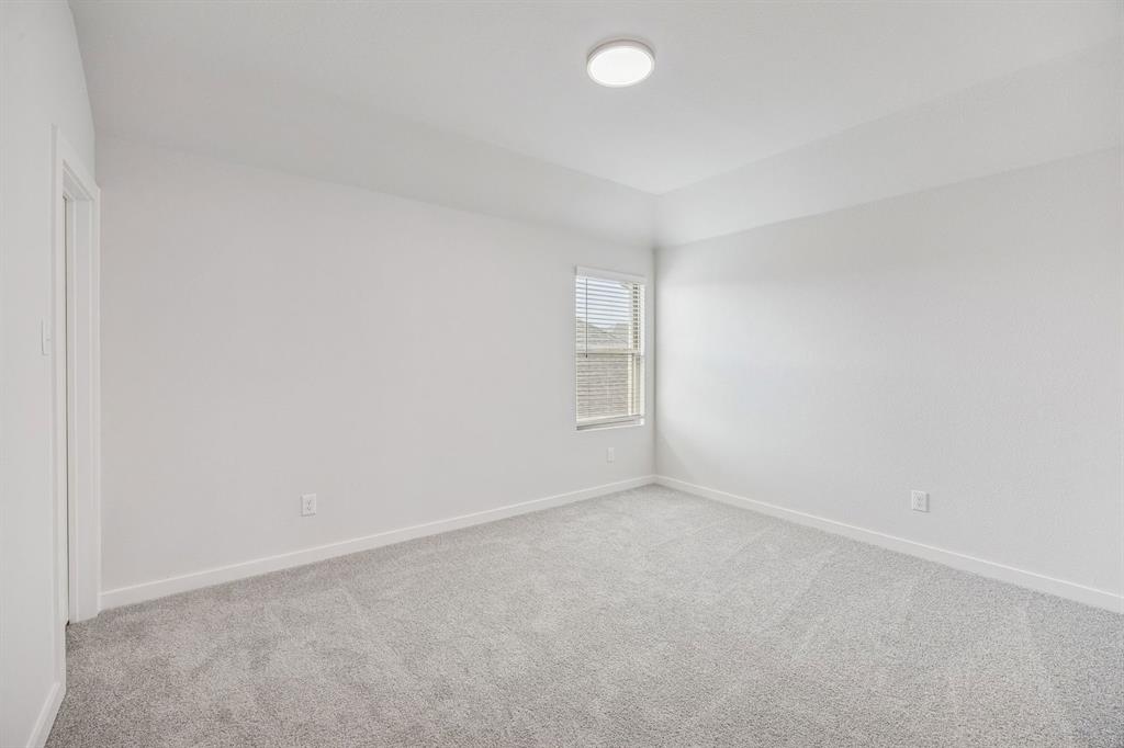 1132 Del Rio Drive Lavon, TX 75166 - Photo 33 of 39 Bedroom in the Stanley II home plan by Trophy Signature Homes – REPRESENTATIVE PHOTO