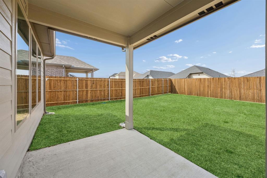 1132 Del Rio Drive Lavon, TX 75166 - Photo 37 of 39 Covered Patio in the Stanley II home plan by Trophy Signature Homes – REPRESENTATIVE PHOTO