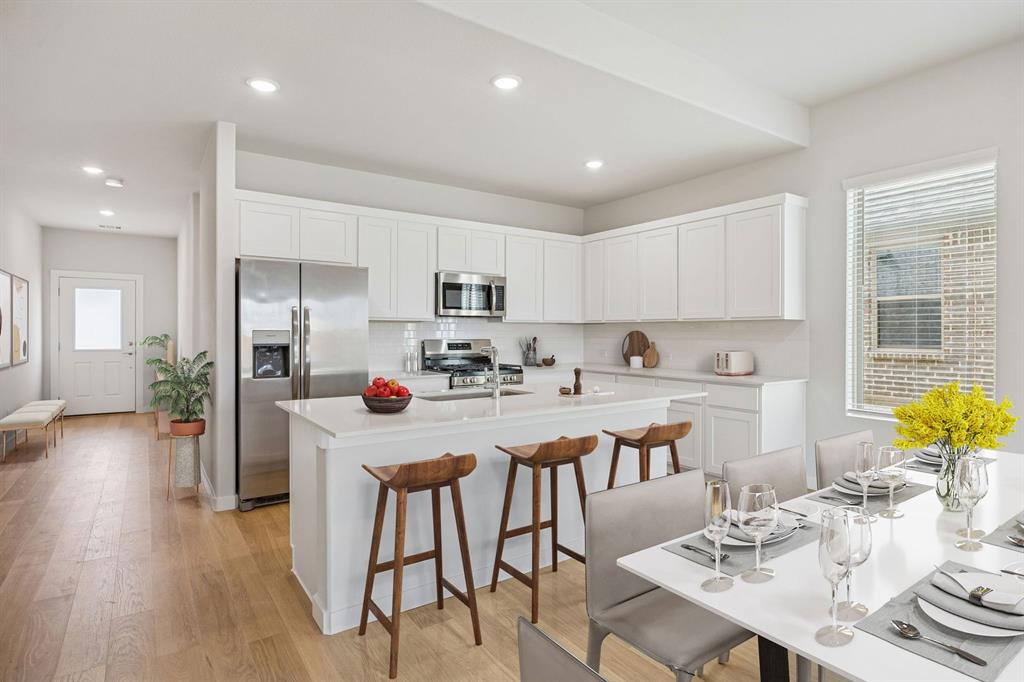 1132 Del Rio Drive Lavon, TX 75166 - Photo 6 of 39 Kitchen in the Stanley II home plan by Trophy Signature Homes – REPRESENTATIVE PHOTO
