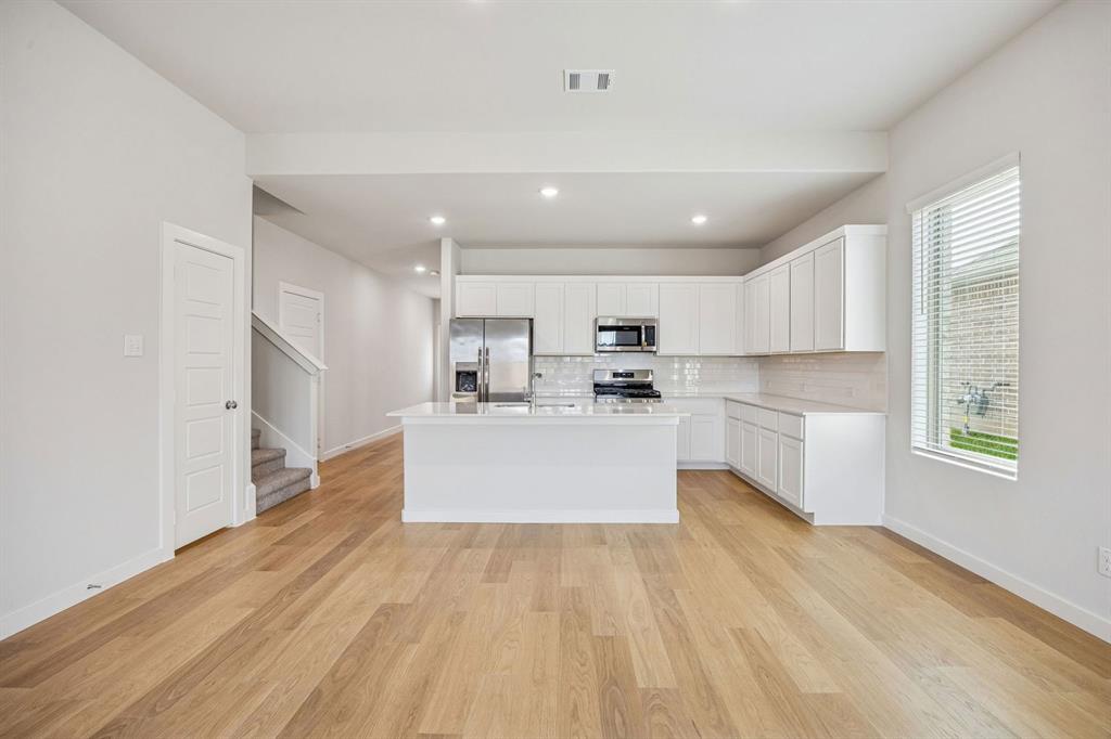 1132 Del Rio Drive Lavon, TX 75166 - Photo 7 of 39 Kitchen in the Stanley II home plan by Trophy Signature Homes – REPRESENTATIVE PHOTO