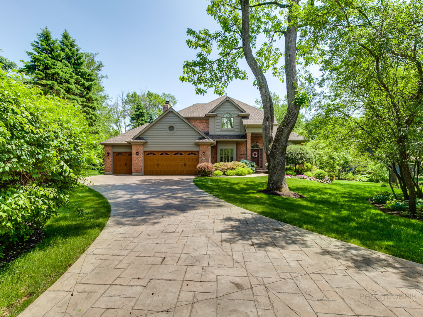 1127 South Ridge Road Lake Forest, IL 60045 - Photo 1 of 35 a front view of a house with garden