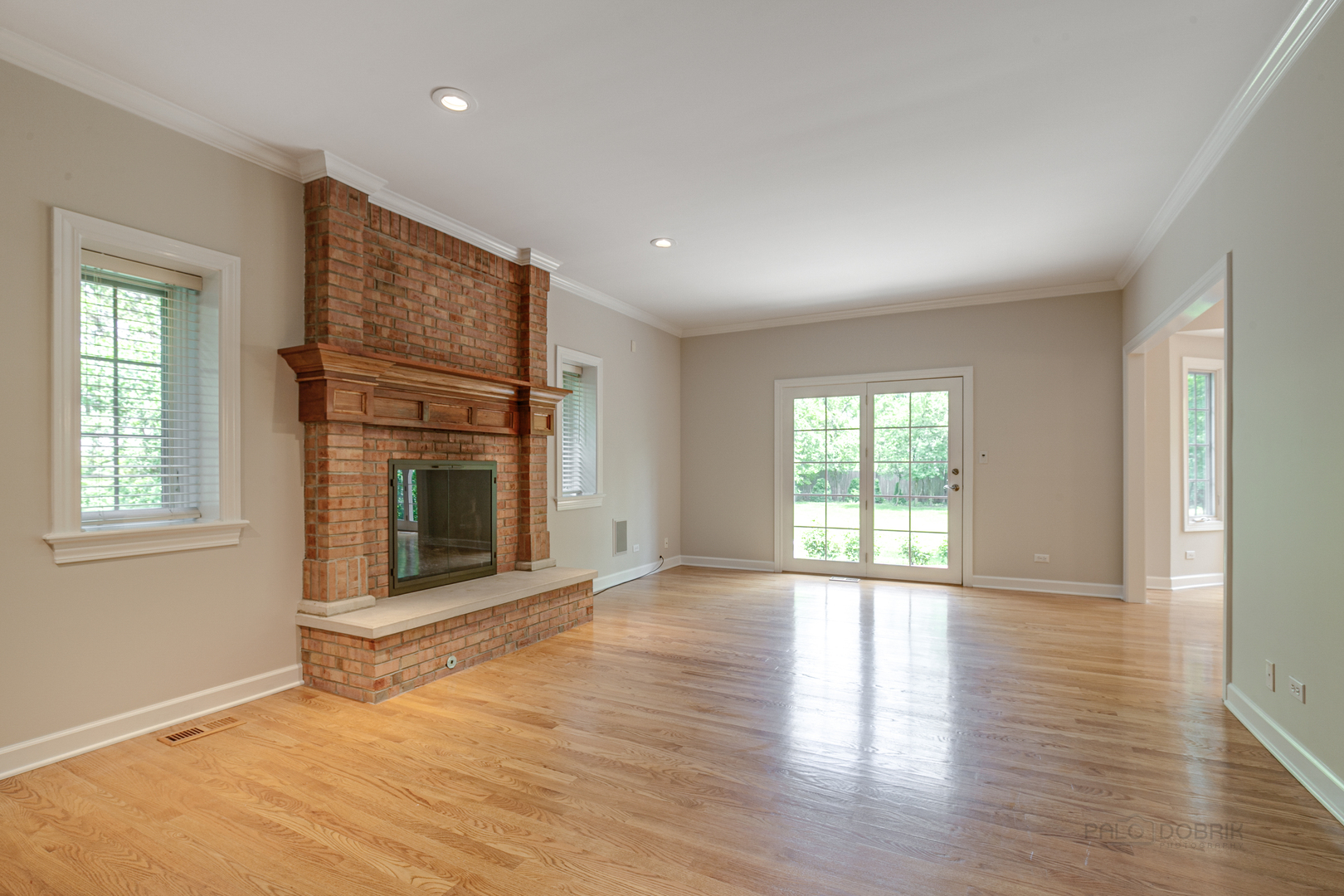 1127 South Ridge Road Lake Forest, IL 60045 - Photo 14 of 35 an empty room with windows and fireplace