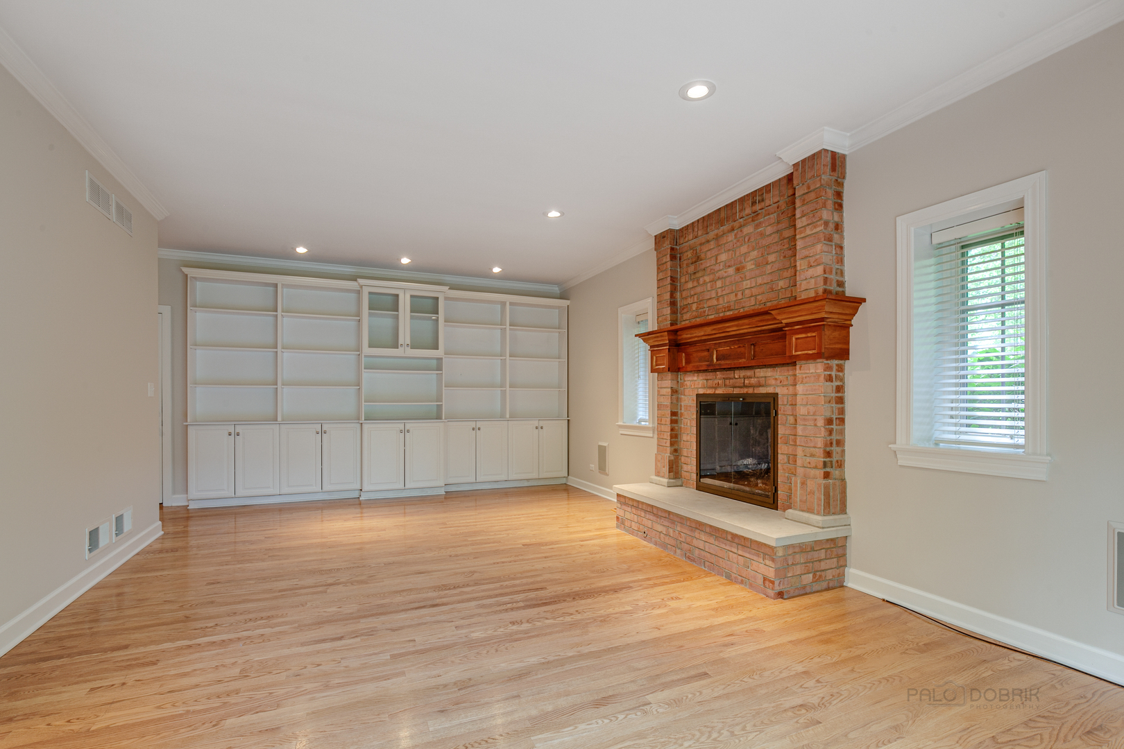 1127 South Ridge Road Lake Forest, IL 60045 - Photo 15 of 35 an empty room with windows and fireplace