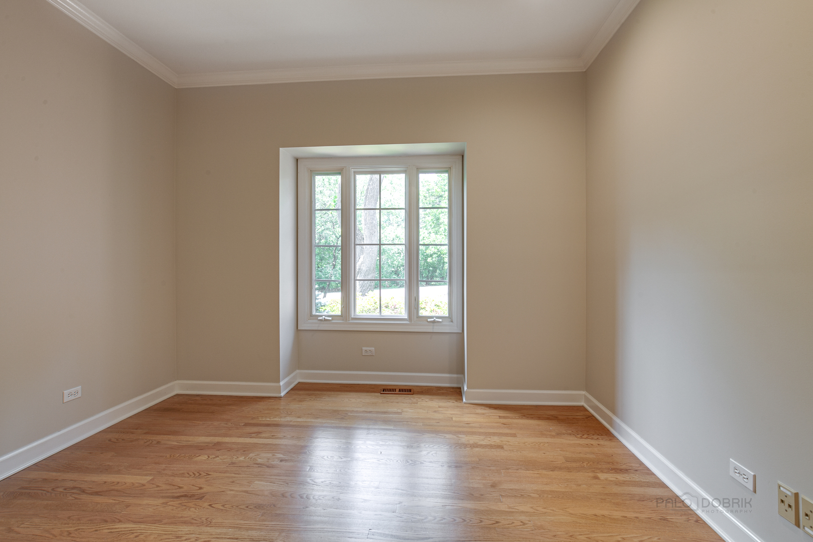 1127 South Ridge Road Lake Forest, IL 60045 - Photo 16 of 35 wooden floor in an empty room with a window