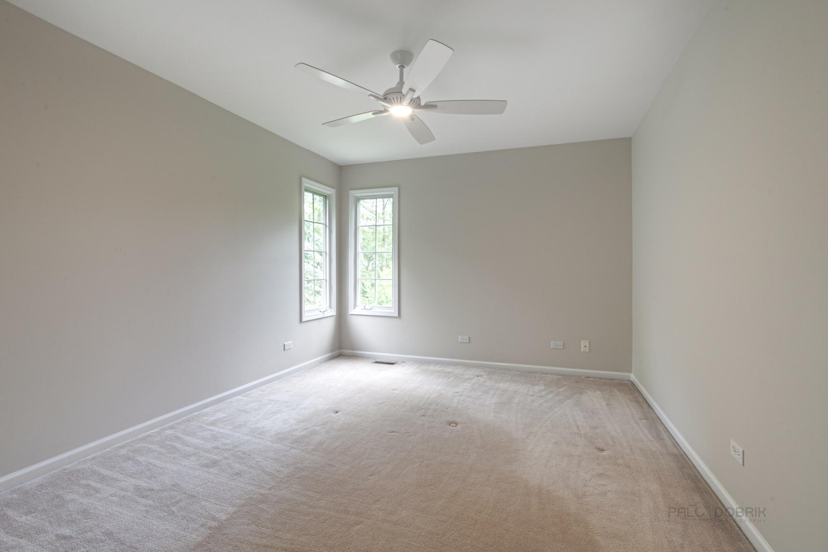 1127 South Ridge Road Lake Forest, IL 60045 - Photo 23 of 35 an empty room with windows and fan