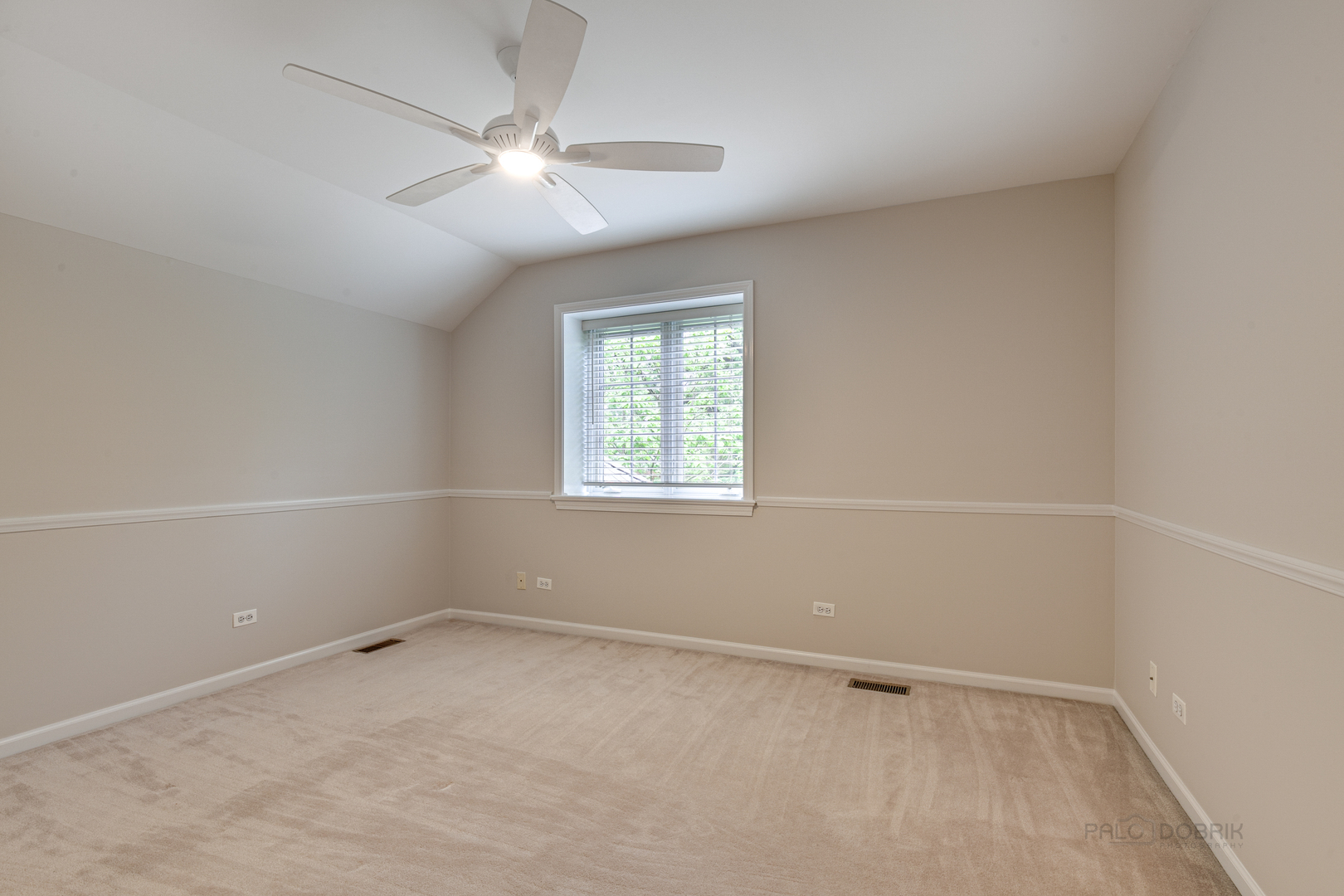 1127 South Ridge Road Lake Forest, IL 60045 - Photo 24 of 35 an empty room with a window and a fan