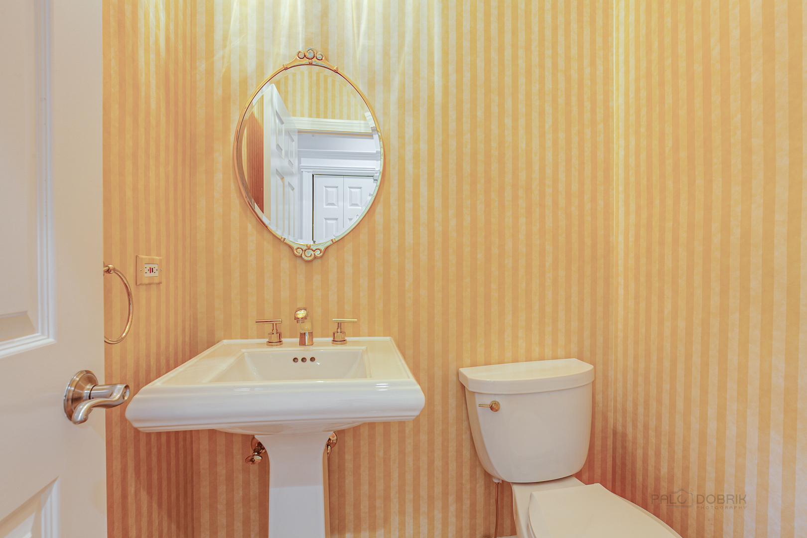 1127 South Ridge Road Lake Forest, IL 60045 - Photo 30 of 35 a bathroom with a toilet a sink and a mirror