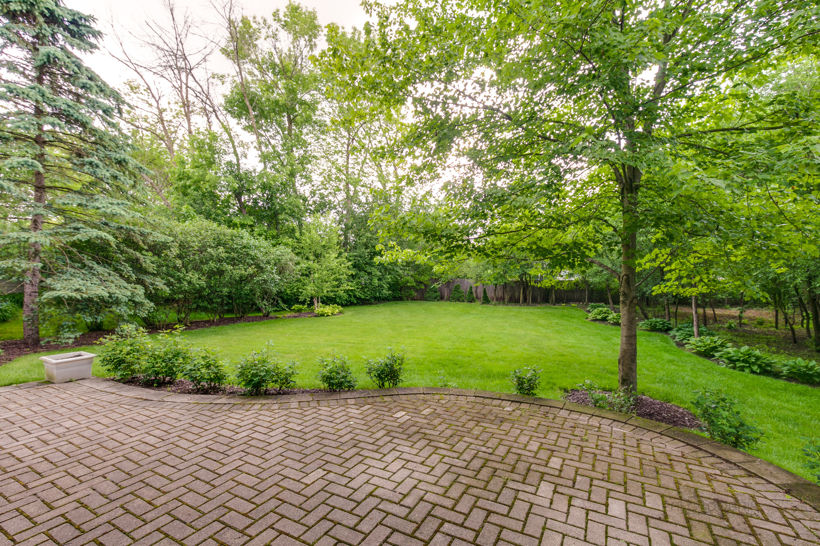 1127 South Ridge Road Lake Forest, IL 60045 - Photo 32 of 35 a view of a street with a yard and large trees
