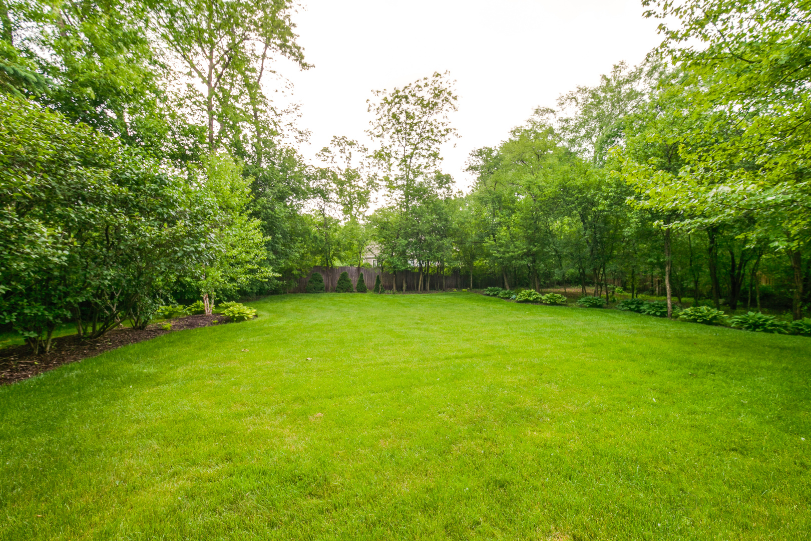 1127 South Ridge Road Lake Forest, IL 60045 - Photo 34 of 35 a view of a yard with a trees
