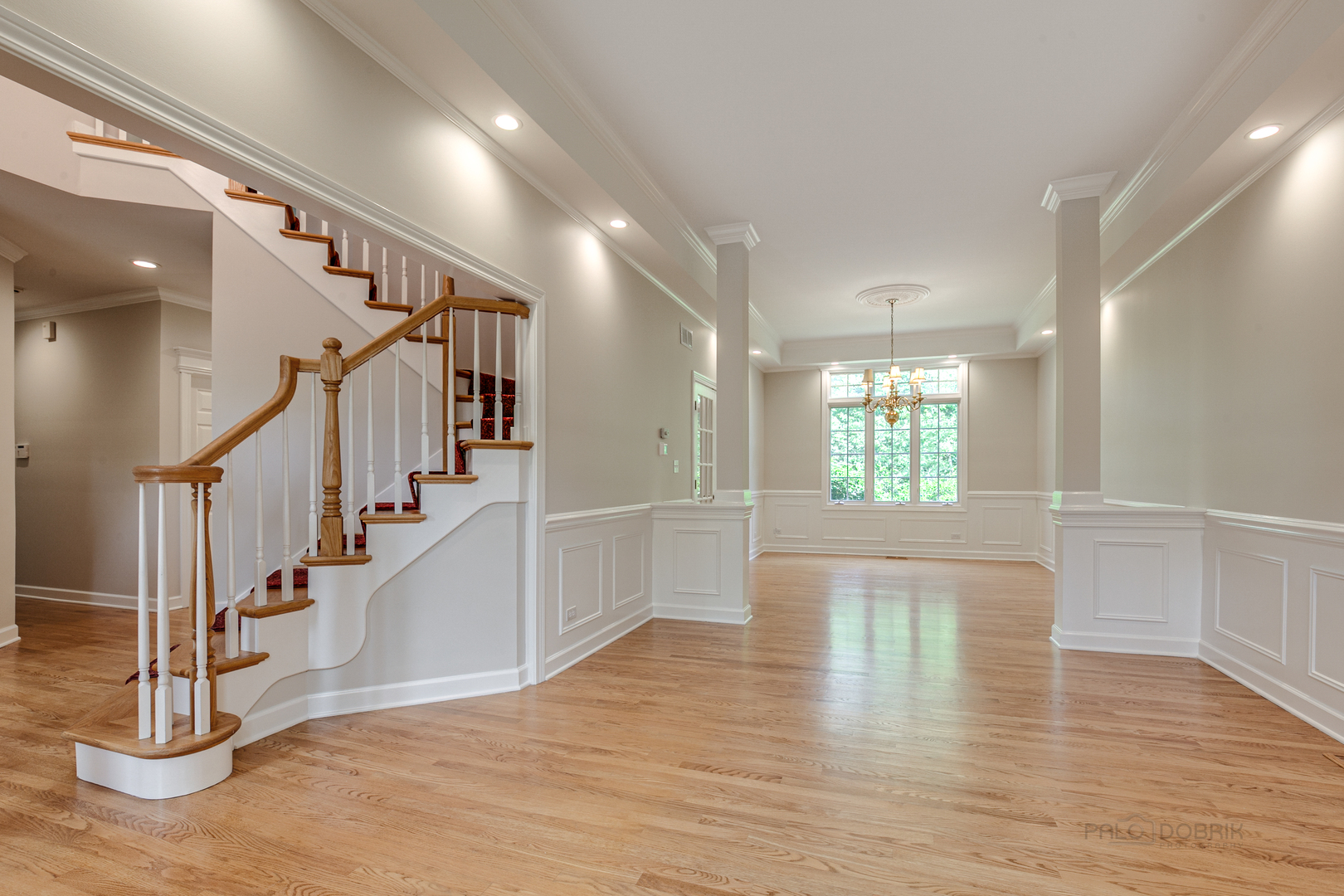1127 South Ridge Road Lake Forest, IL 60045 - Photo 6 of 35 a view of entryway and hall with wooden floor