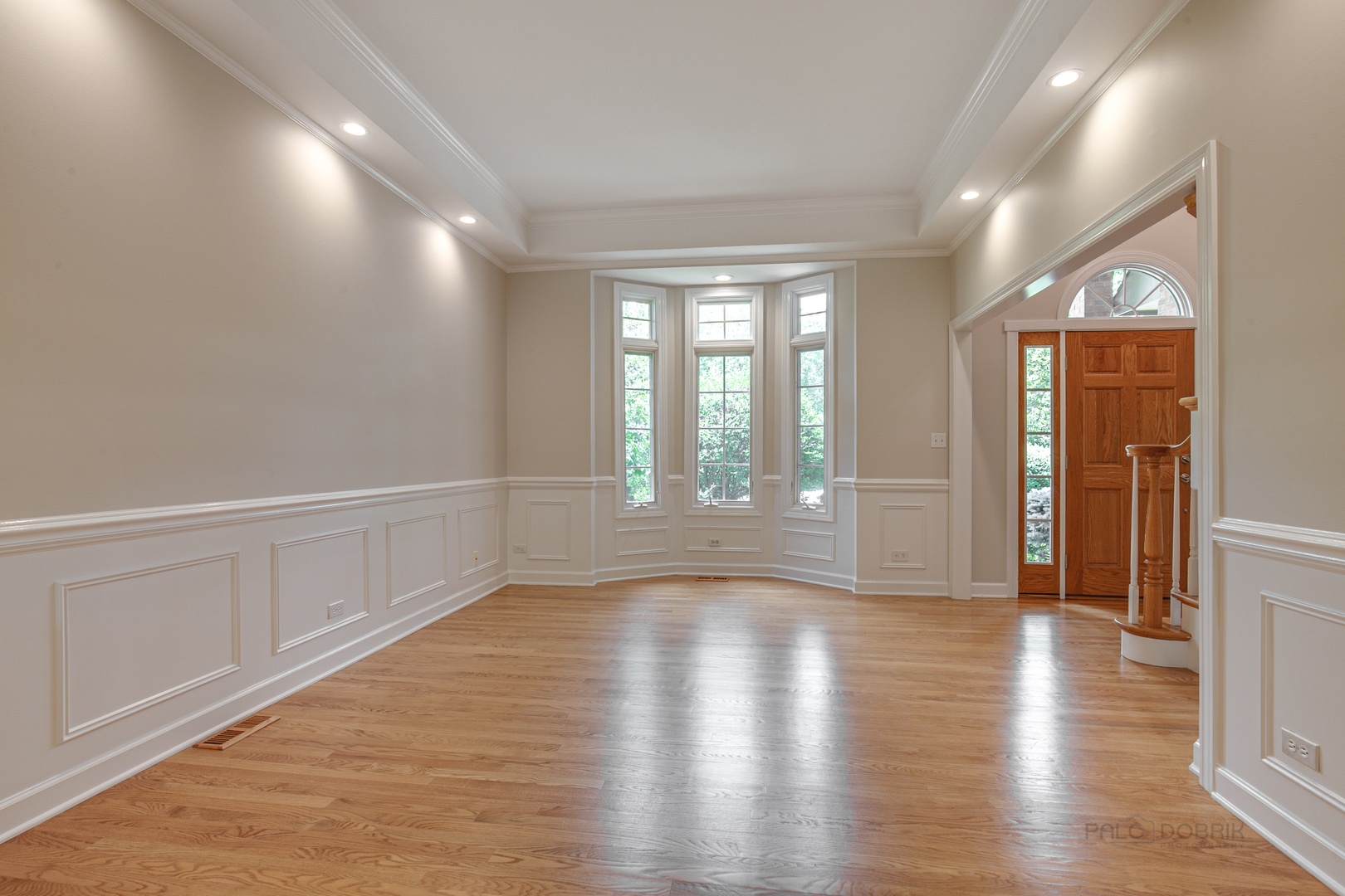 1127 South Ridge Road Lake Forest, IL 60045 - Photo 7 of 35 a view of an empty room with wooden floor and a window