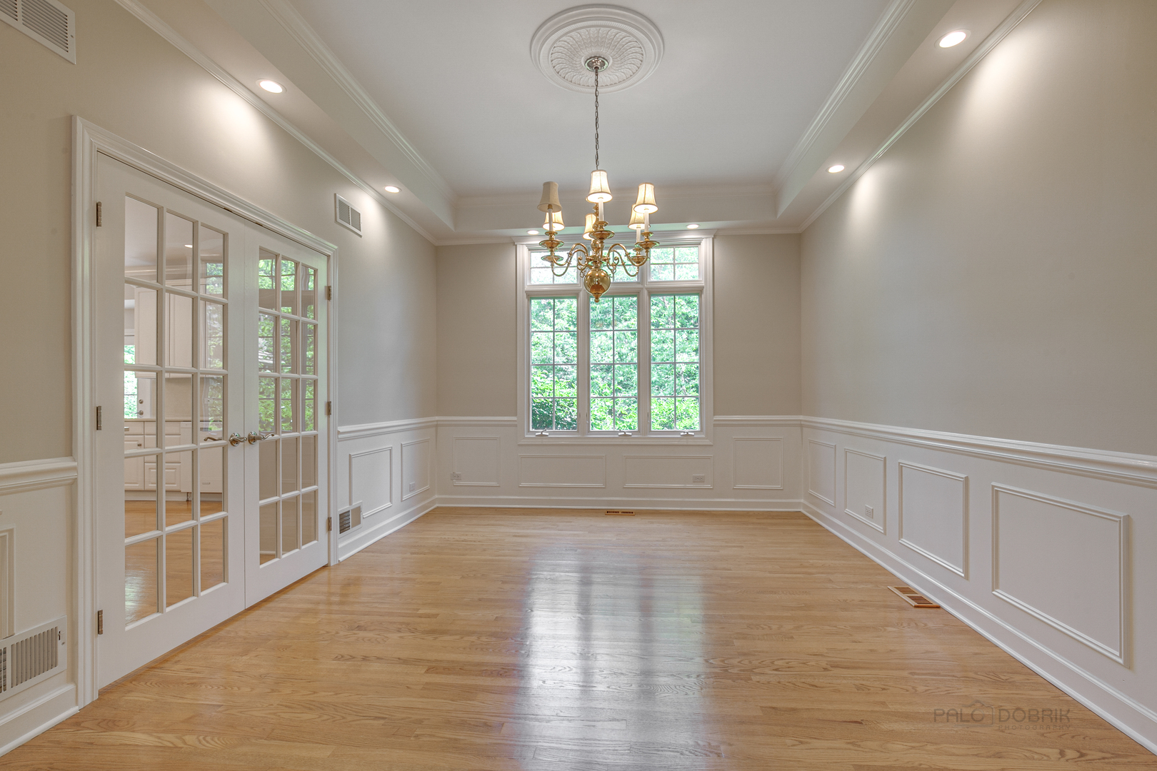1127 South Ridge Road Lake Forest, IL 60045 - Photo 8 of 35 an empty room with wooden floor and windows