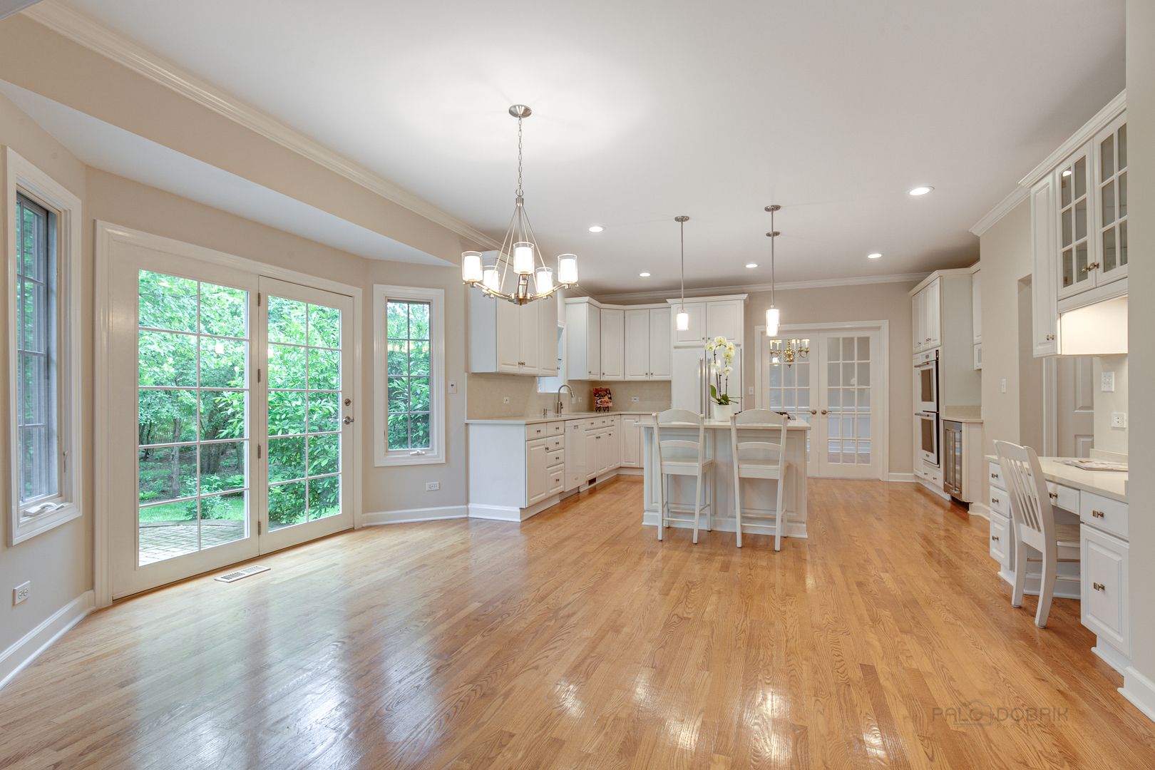 1127 South Ridge Road Lake Forest, IL 60045 - Photo 9 of 35 a dining room with stainless steel appliances furniture large window and wooden floor