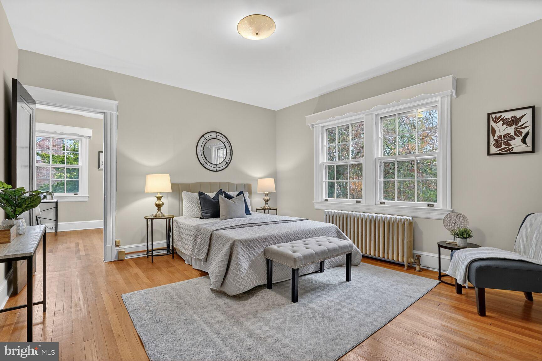 4214 37th Street Northwest Washington, DC 20008 - Photo 20 of 41 a bedroom with a bed and wooden floor