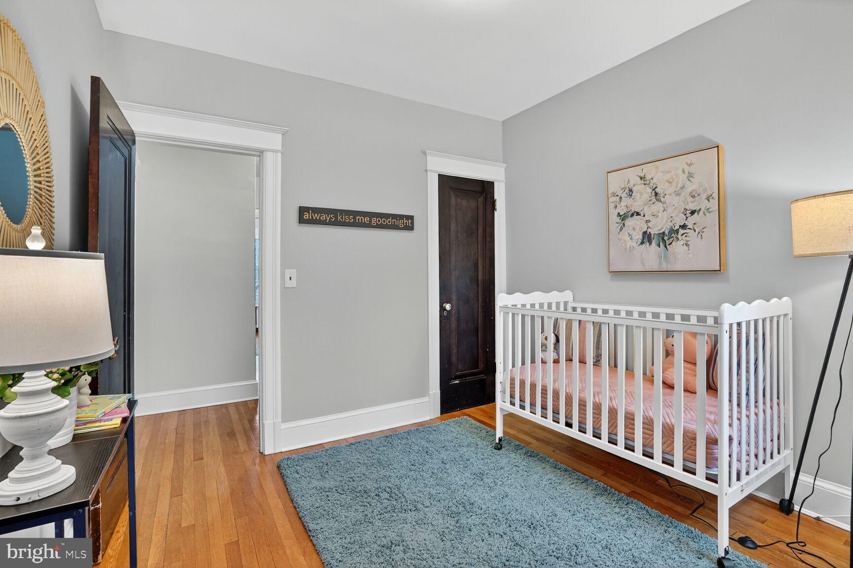 4214 37th Street Northwest Washington, DC 20008 - Photo 24 of 41 a view of a bedroom with furniture wooden floor and window