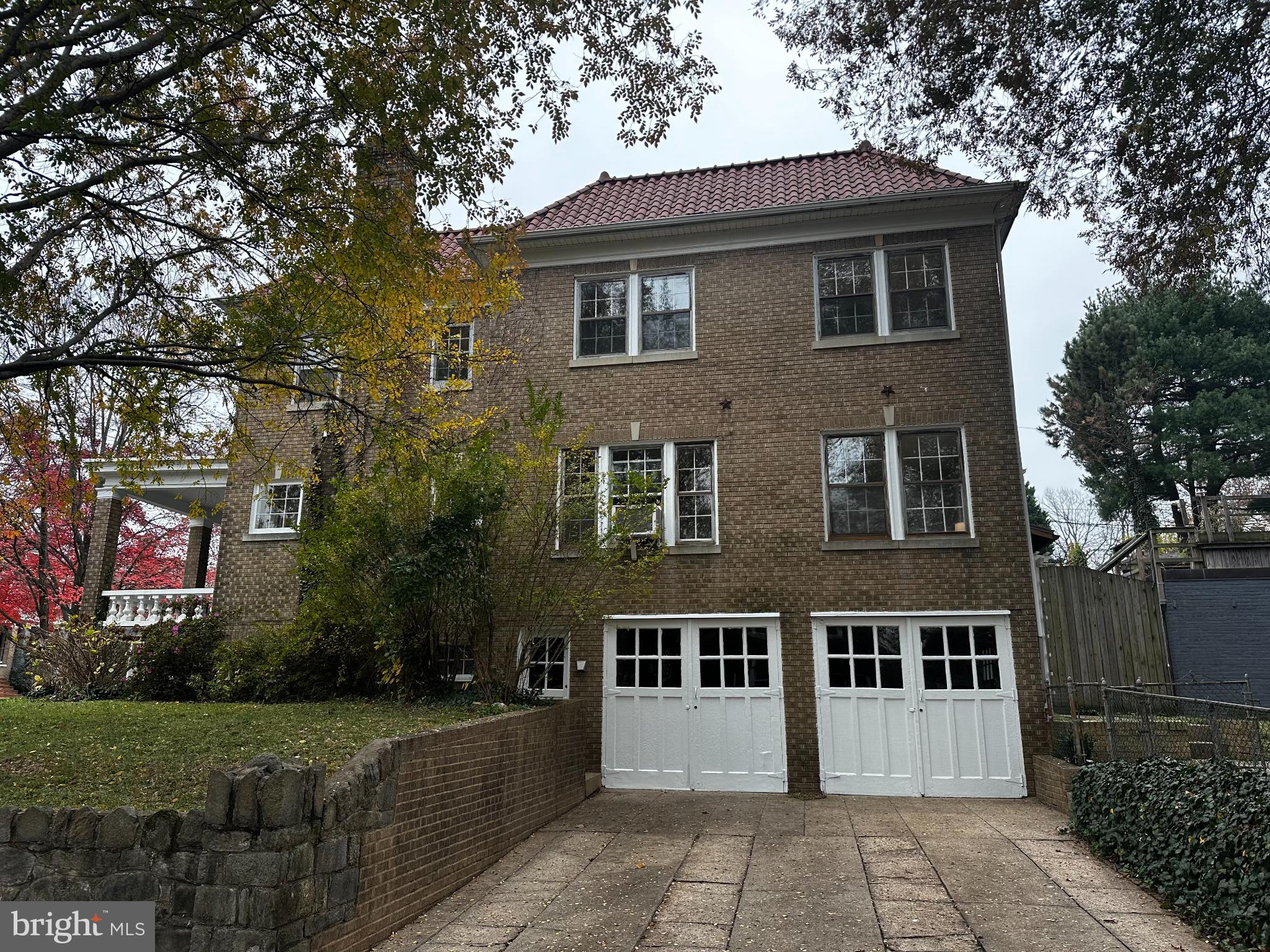 4214 37th Street Northwest Washington, DC 20008 - Photo 32 of 41 a front view of a house with a yard