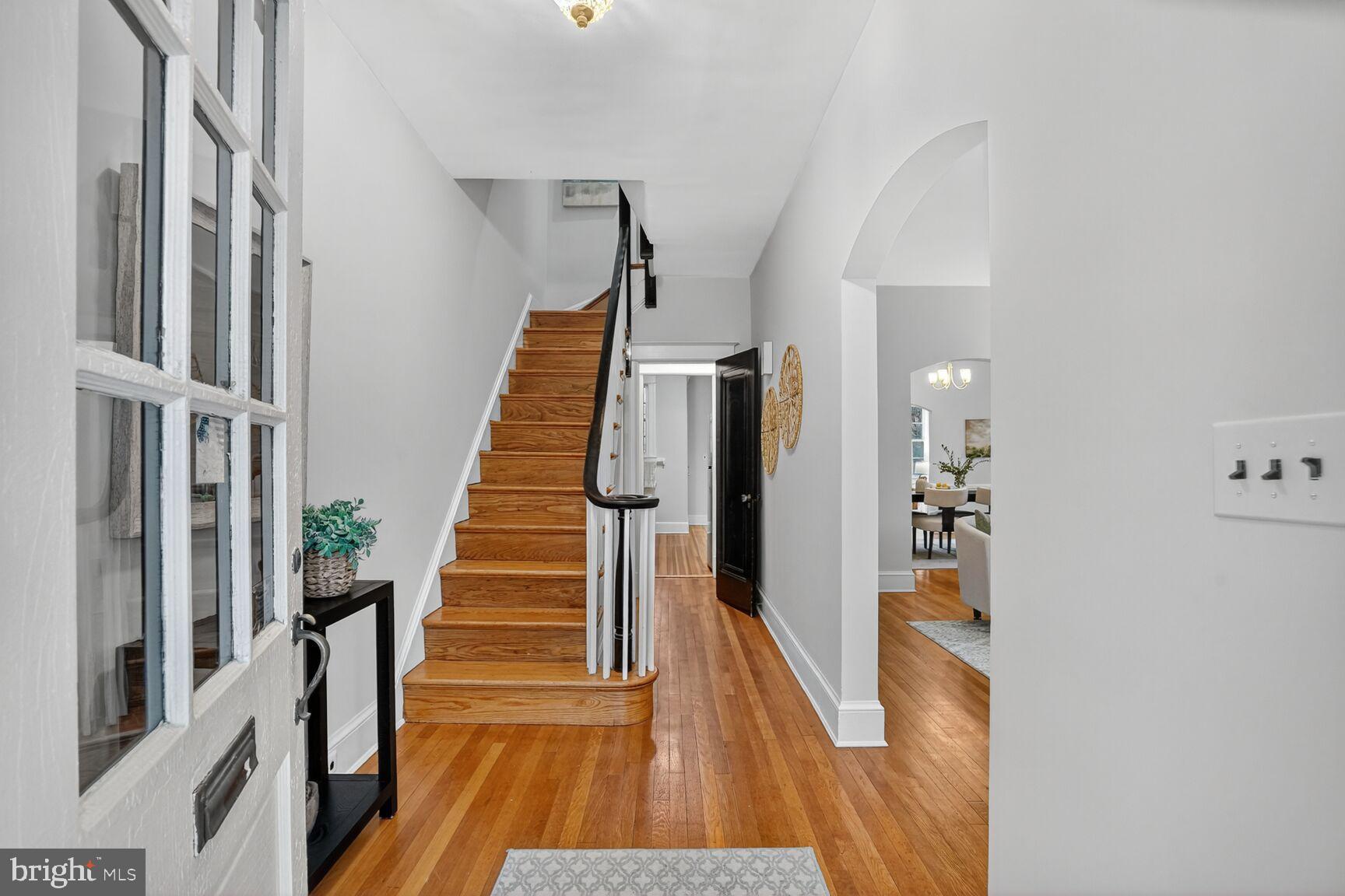 4214 37th Street Northwest Washington, DC 20008 - Photo 4 of 41 a view of a hallway with wooden floor and staircase