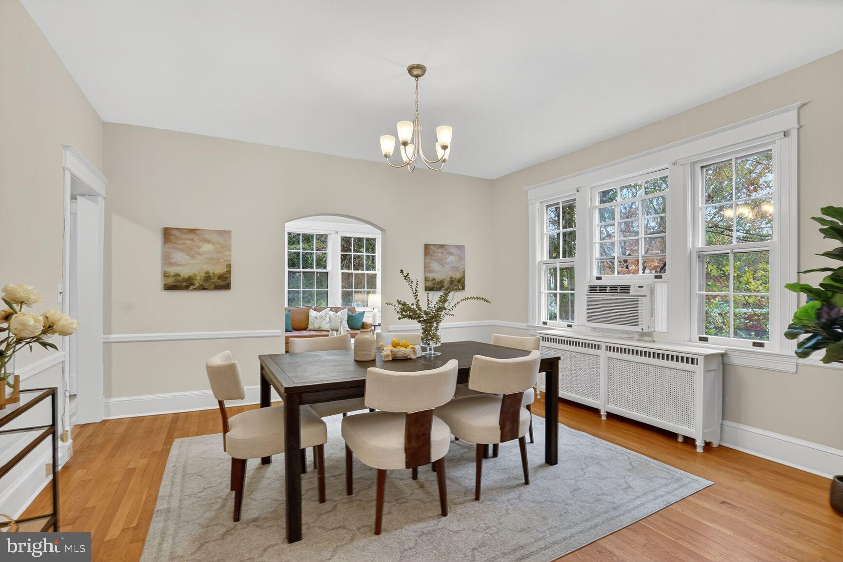 4214 37th Street Northwest Washington, DC 20008 - Photo 8 of 41 a view of a dining room with furniture large windows and wooden floor