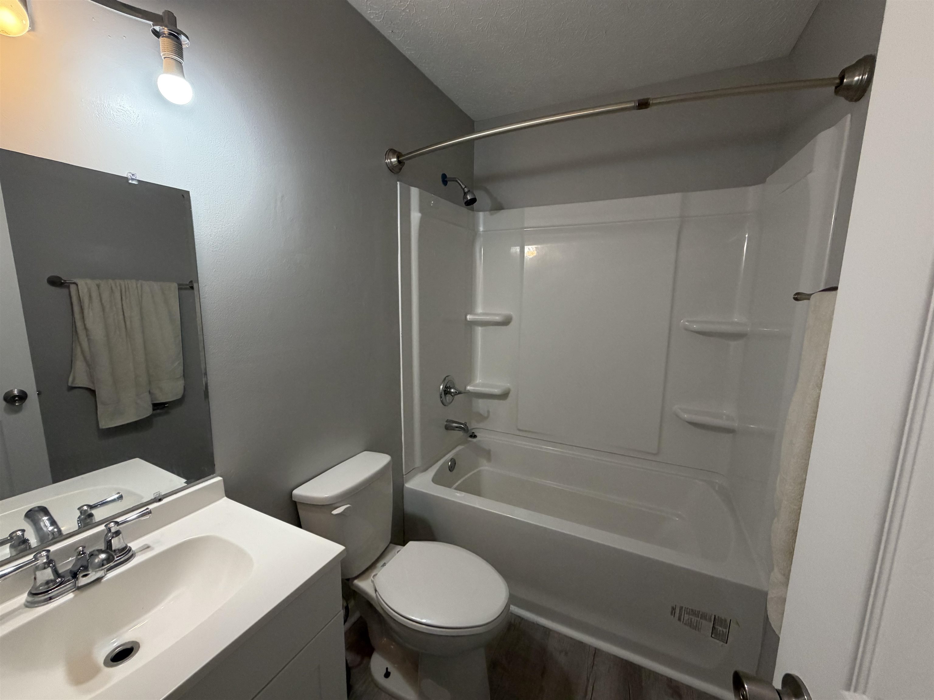 607 Geddings Drive Myrtle Beach, SC 29588 - Photo 14 of 21 Bathroom with vanity, shower / tub combination, and a textured ceiling