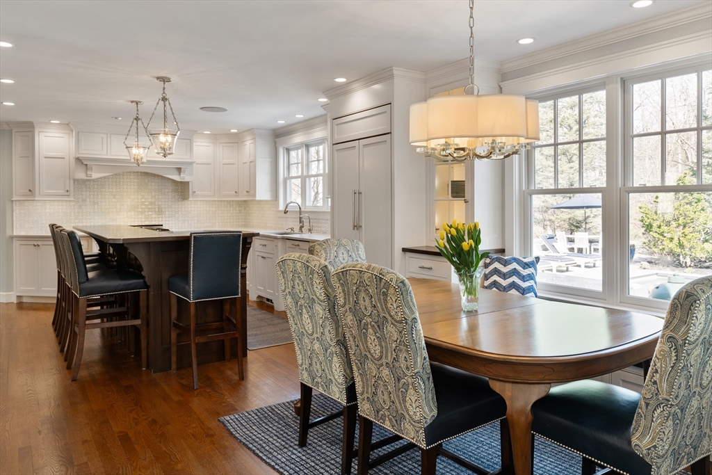 55 Depot Road Boxford, MA 01921 - Photo 16 of 42 a dining room with furniture a chandelier and wooden floor
