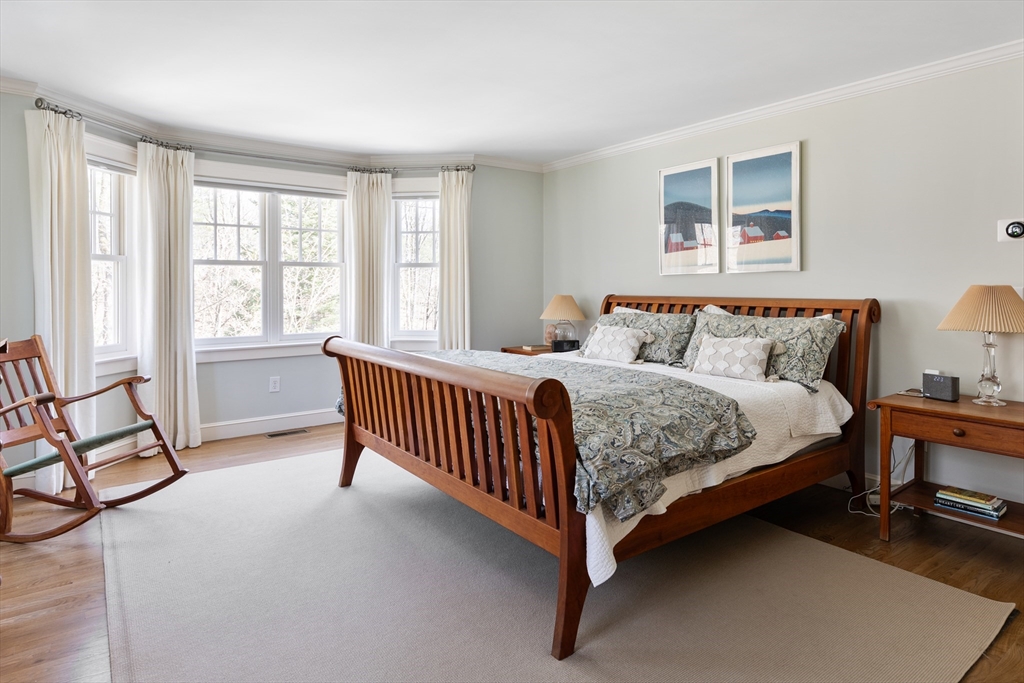 55 Depot Road Boxford, MA 01921 - Photo 32 of 42 a bedroom with a bed and a window with balcony view