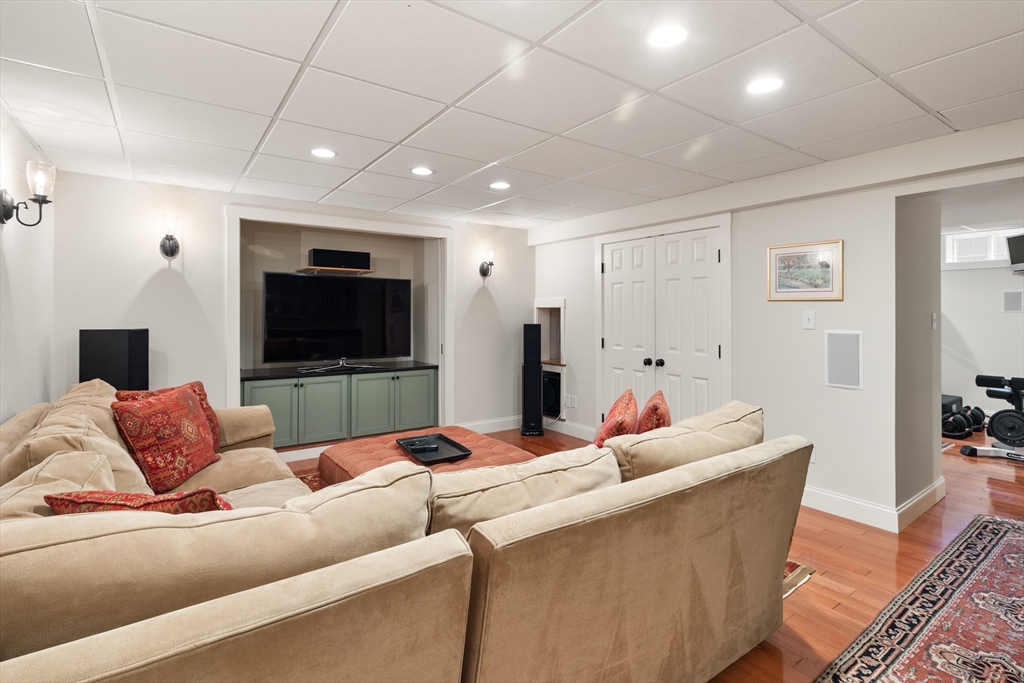 55 Depot Road Boxford, MA 01921 - Photo 37 of 42 a living room with furniture and a flat screen tv