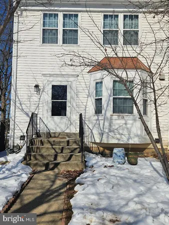 a front view of a house with parking