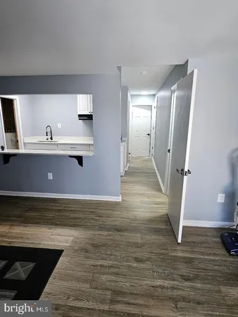 a view of a hardwood floor and staircase