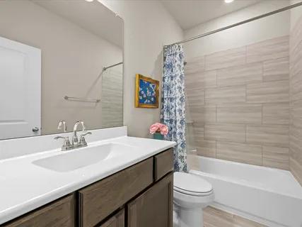 a bathroom with a sink a toilet and a bathtub