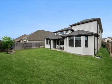 a view of a house with a big yard