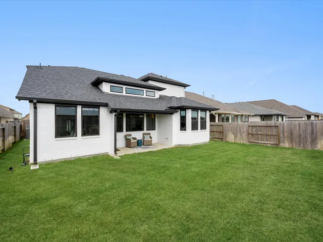 a front view of a house with a garden and porch